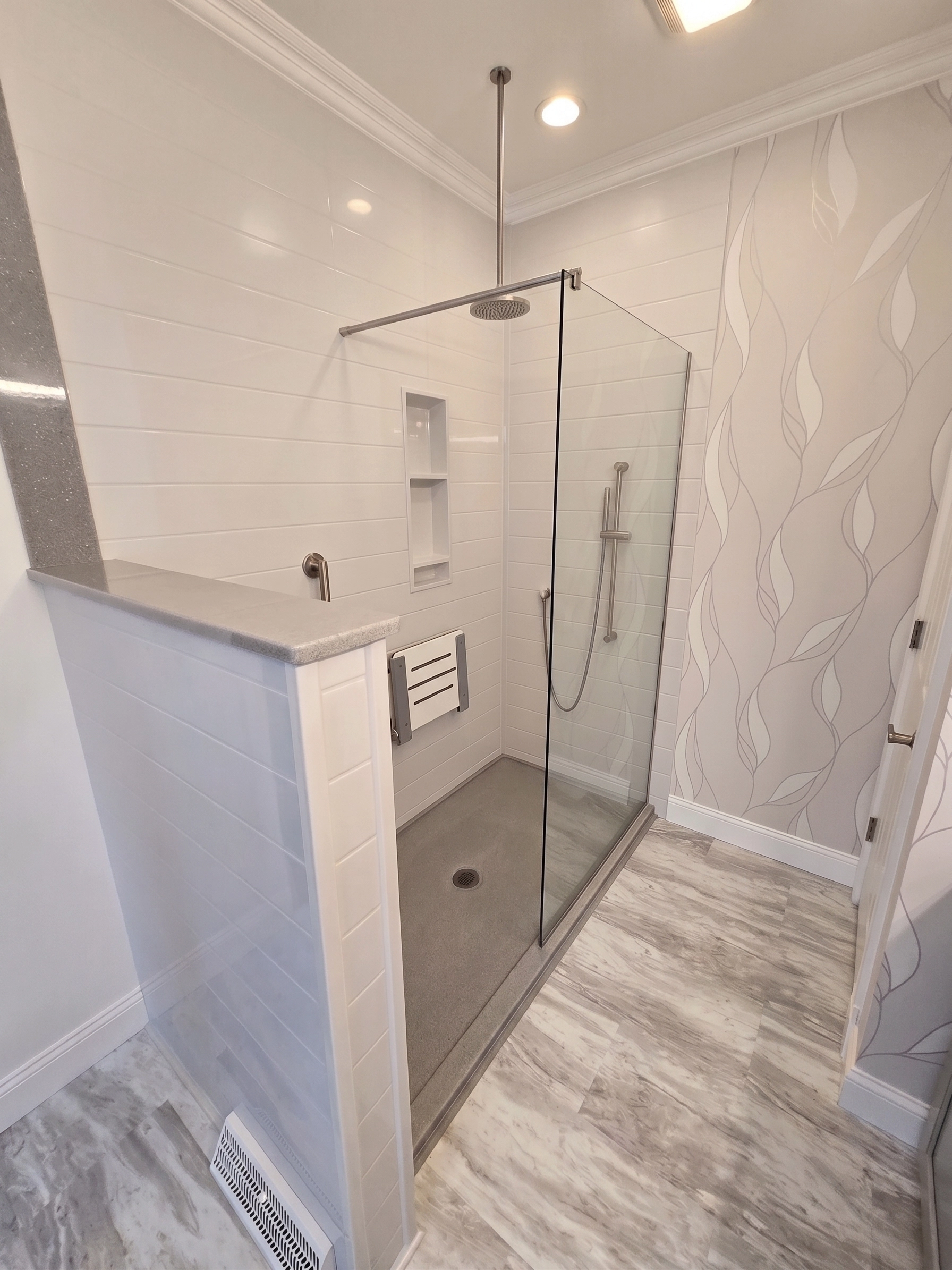 newly installed 80-inch walk-in shower with fixed pane of glass after handicap-accessible remodel in manlius ny