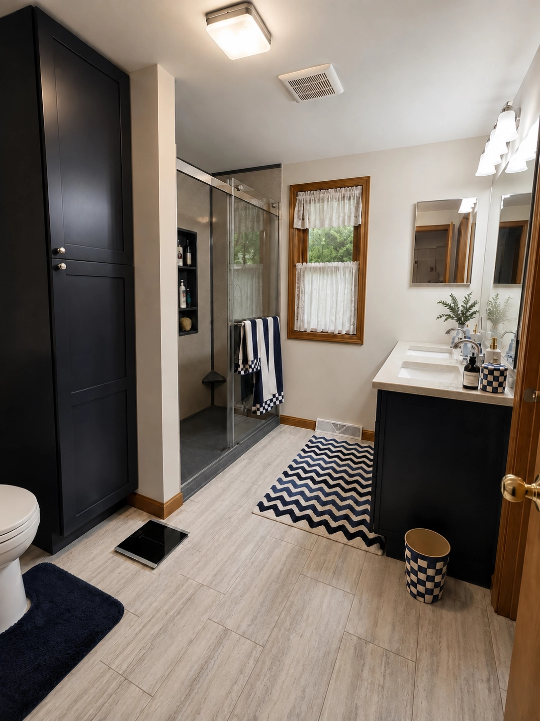 A completed full bathroom remodel in Cicero NY featuring an Onyx Collection walk-in shower, Tarkett ProGen LVT flooring, custom vanity top and all-hardwood Fabuwood cabinetry.