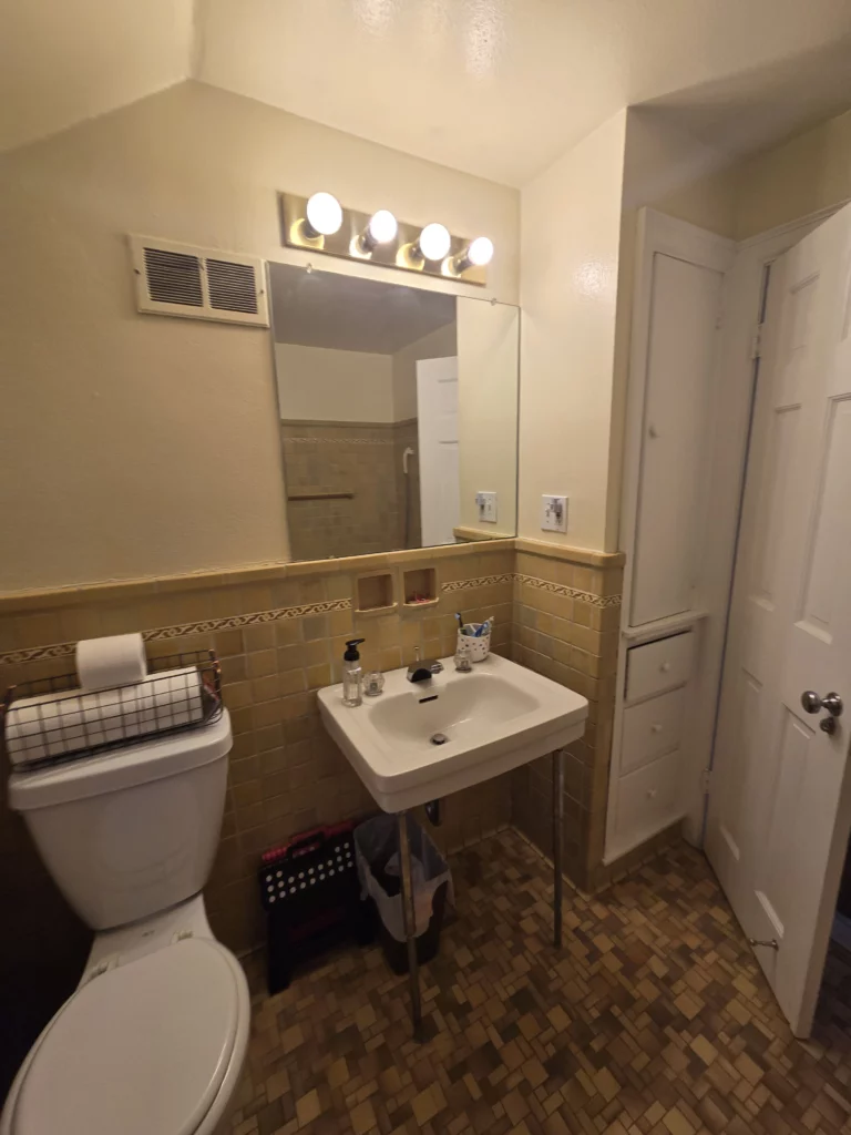 Original small bathroom in a 1938 Colonial home before remodeling in DeWitt, NY.